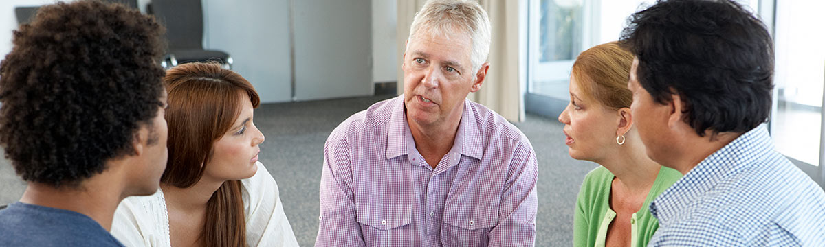 group of adults in counseling circle stock photo