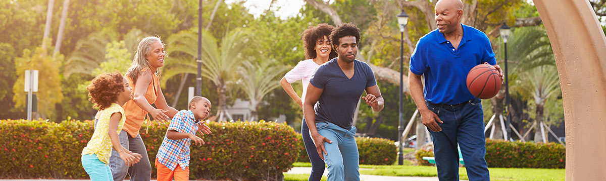 African American family playing basketball stock photo